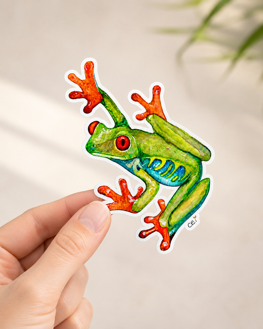 3.5 inch red-eyed frog sticker held in a hand