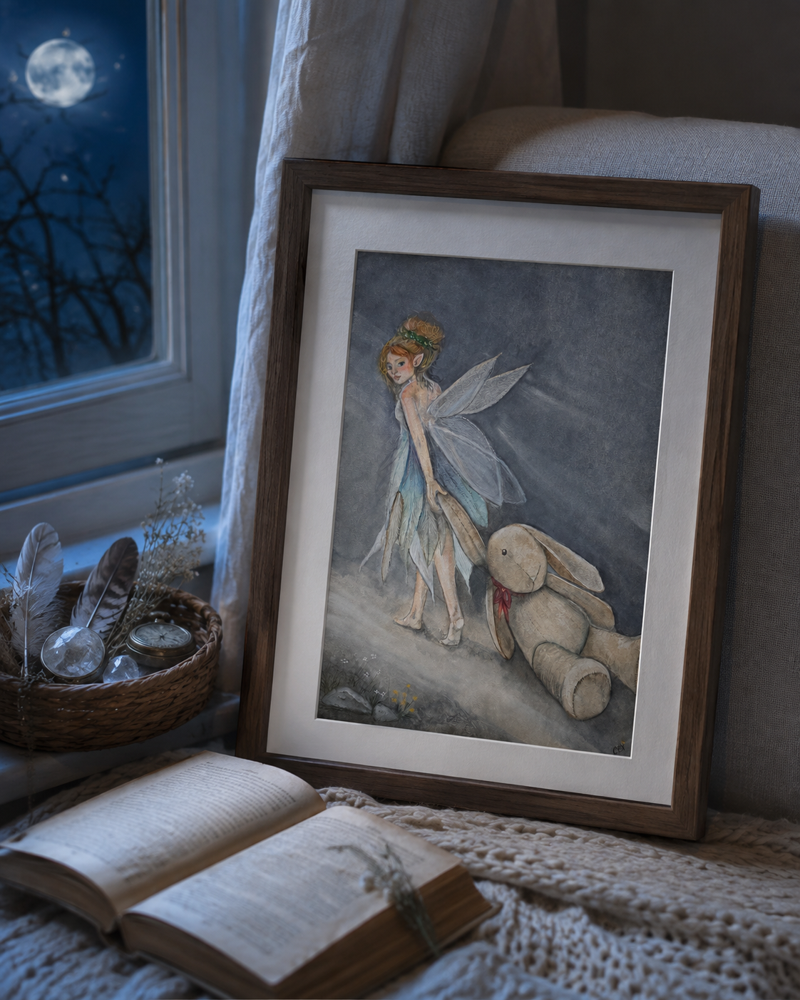 Framed Oona and the Rabbit fairy art print in a quiet woodland studio with field notes, pressed flowers, and found objects.