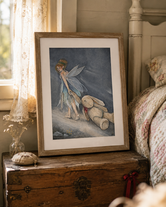 Framed Oona and the Rabbit fairy art print in a moonlit reading nook with a worn storybook and found keepsakes.