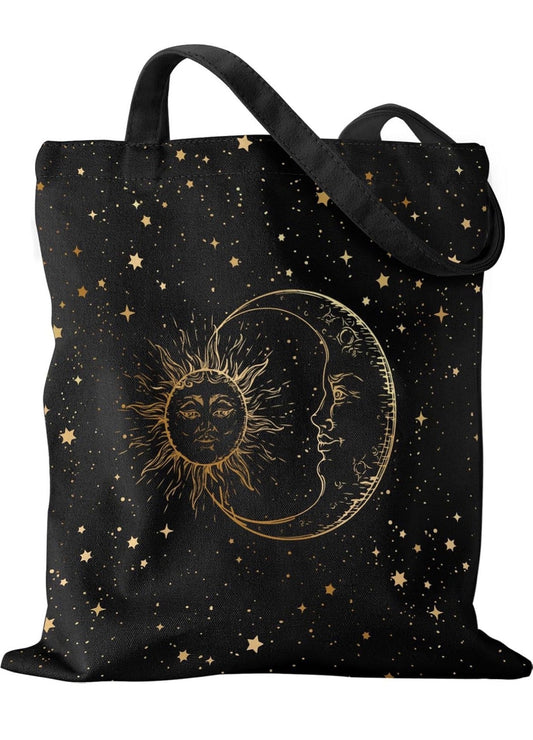 Black celestial tote bag with gold sun and moon print on a starry background
