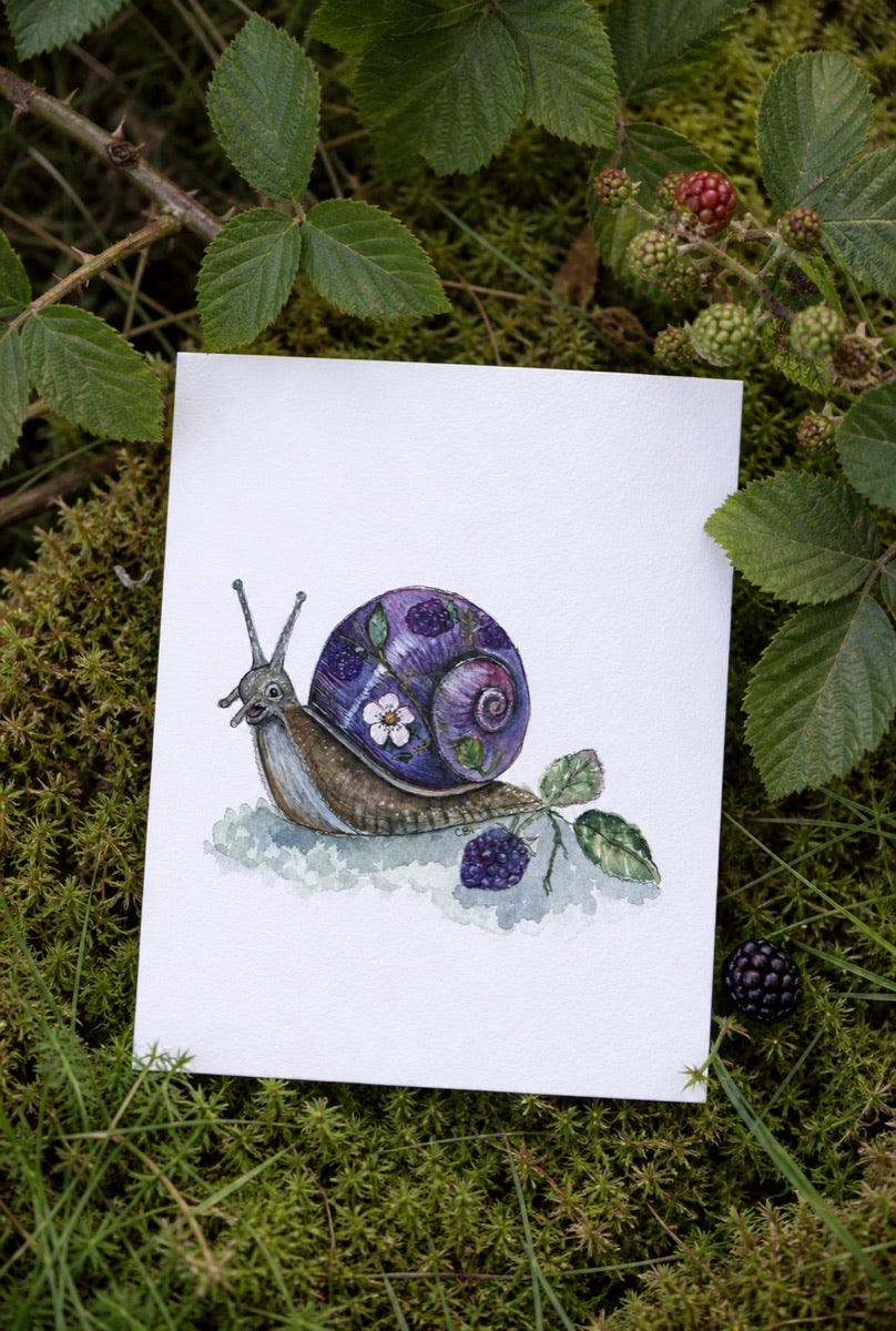 Bramble Snail art print resting on moss beneath blackberry leaves and berries