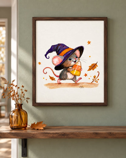 Candy Corn Mischief print in a walnut frame on a sage wall above a shelf and amber vase.