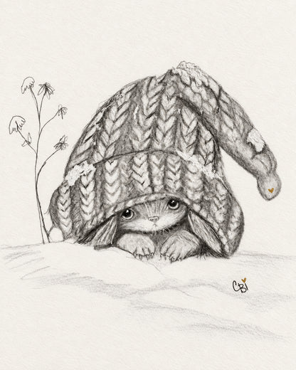 Graphite drawing of a long-eared Capling peeking from an oversized knitted cap, with delicate flowers, two tiny gold hearts and the CBi signature.