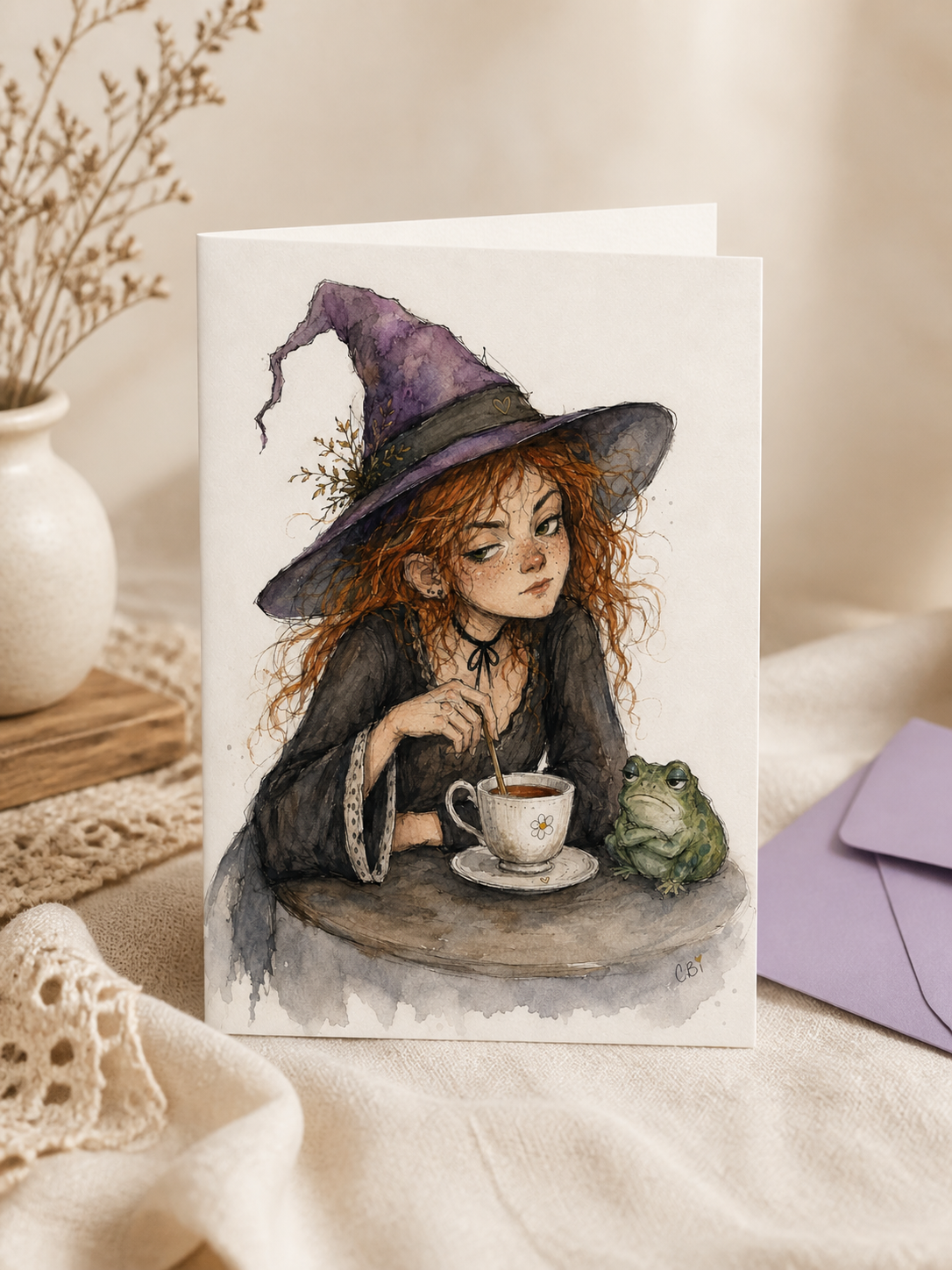 Another view of the Frankie and Wart greeting card, featuring a witch stirring tea beside her frog companion.