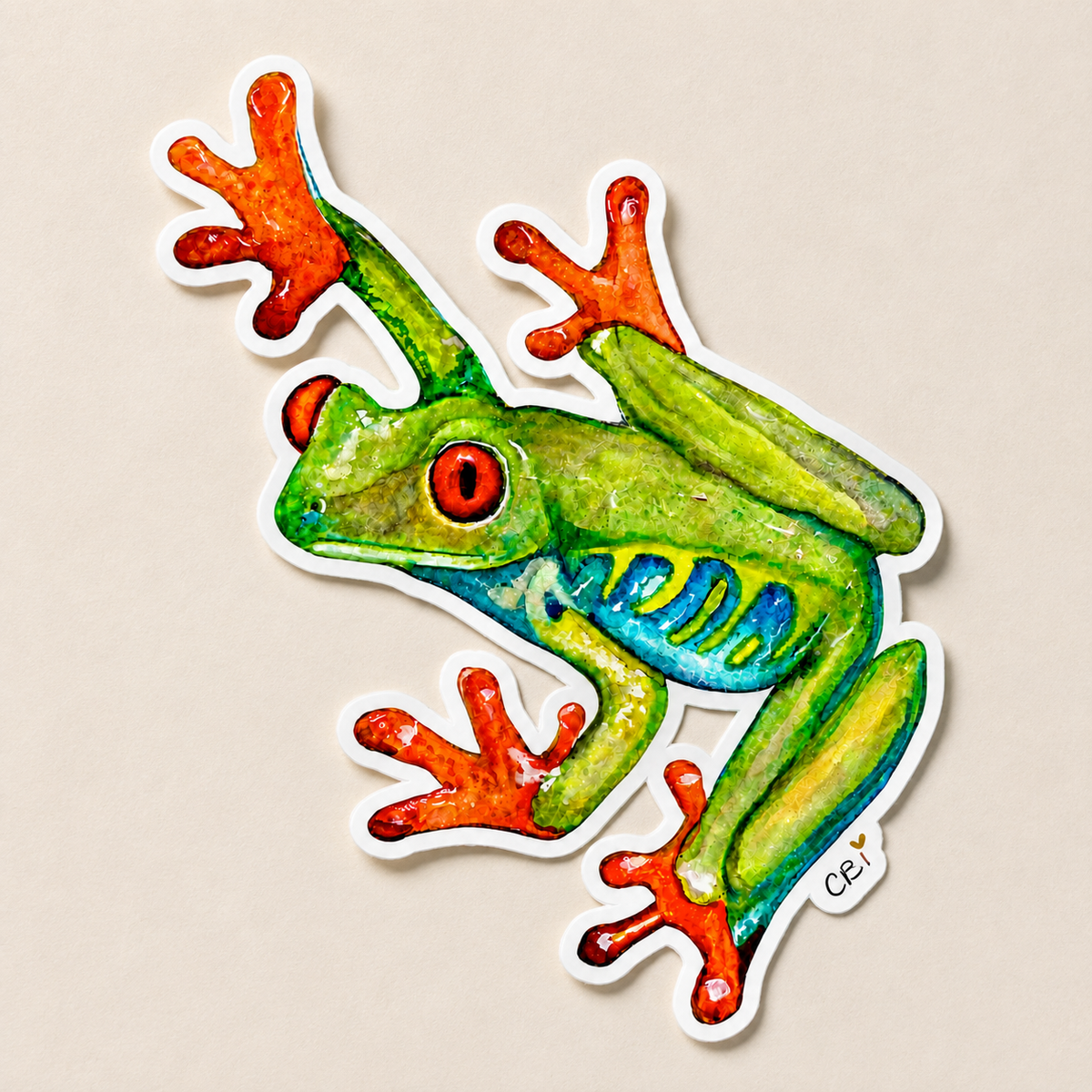 Red-eyed frog sticker shown flat on a neutral surface