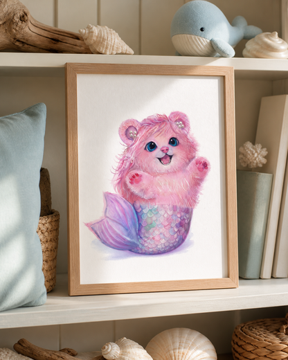 Pearl Mermaid Bear art print displayed in a warm coastal reading nook with shells, driftwood, a woven basket, and a blue whale ornament.