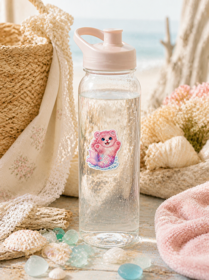 Pearl Mermaid Bear vinyl sticker on a reusable water bottle in a seaside cottagecore setting