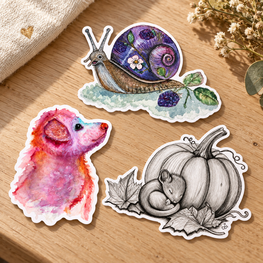 Bramble, Pupkin, and Sleeping Mouse and Pumpkin stickers arranged on an oak table beside linen and dried flowers.
