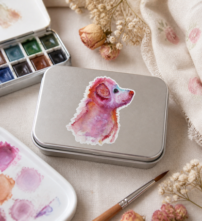Pupkin vinyl sticker on a keepsake art-supply tin with watercolor supplies